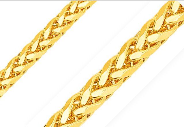 Gold braided necklace on a white background