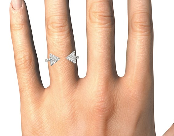 Silver triangle earrings on a hand against a white background