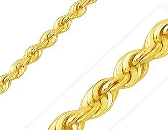 Gold rope chain on a white background close-up.