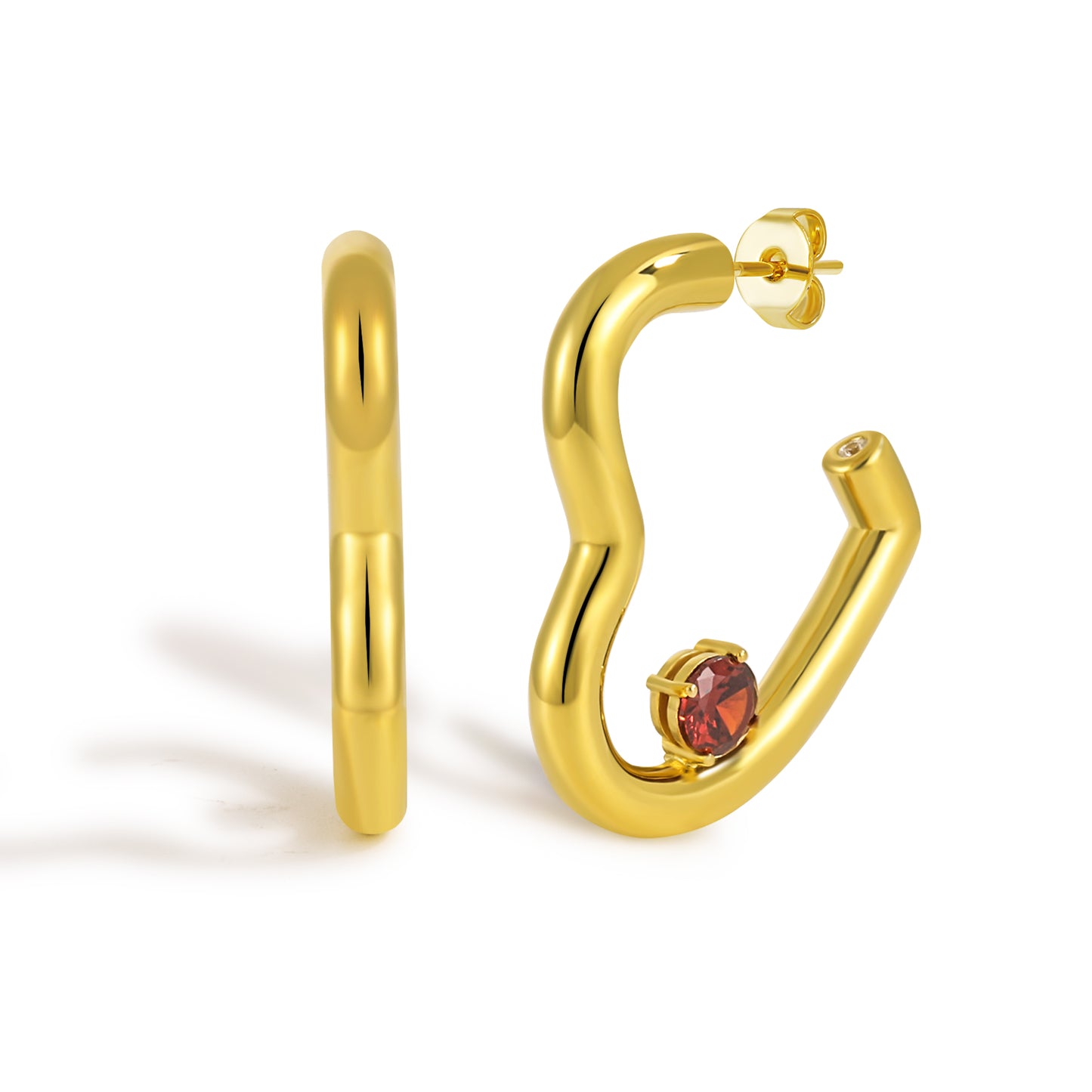 Gold hoop earrings with a red gemstone on a white background