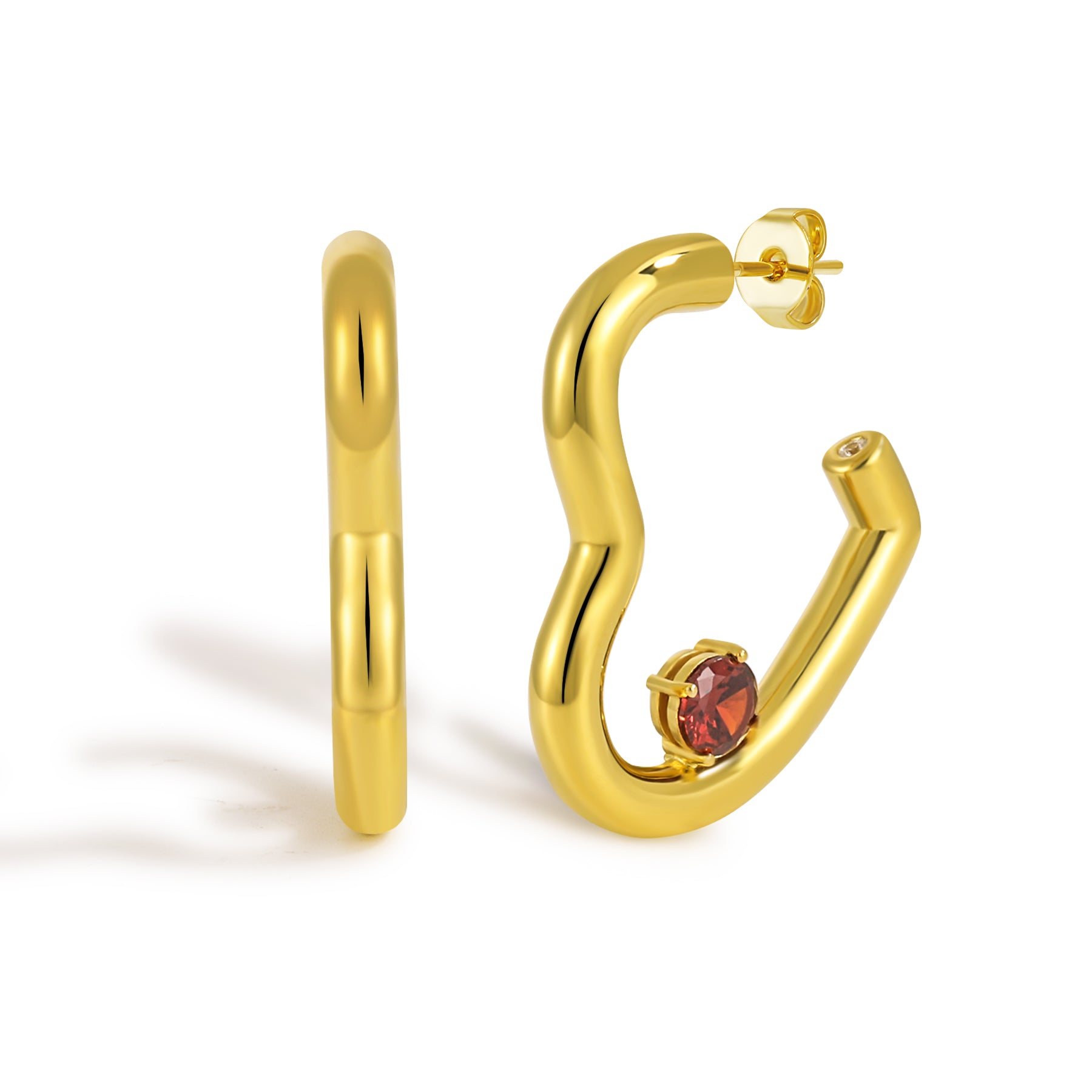 Gold hoop earrings with a red gemstone on a white background