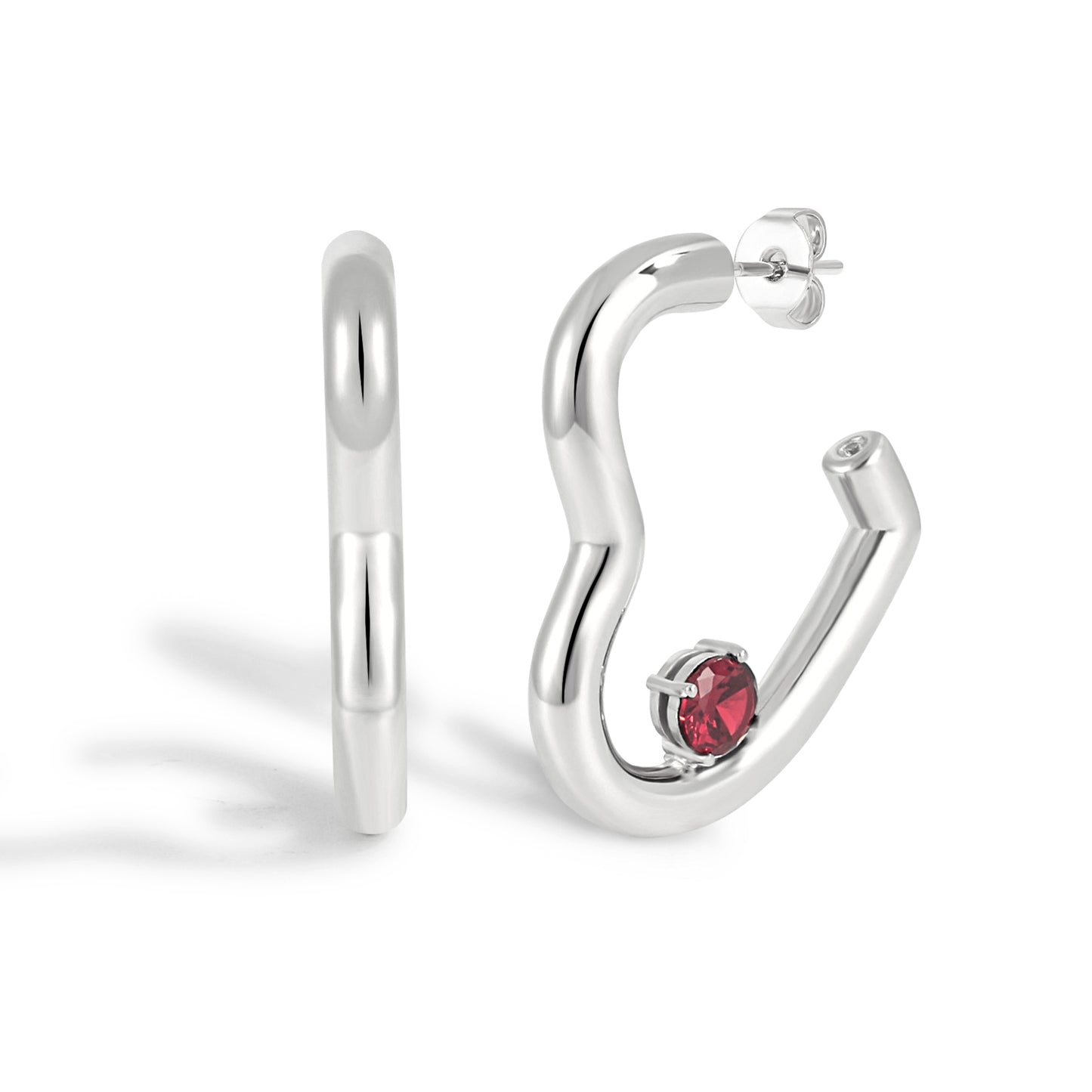 Silver hoop earrings with a red gemstone on a white background