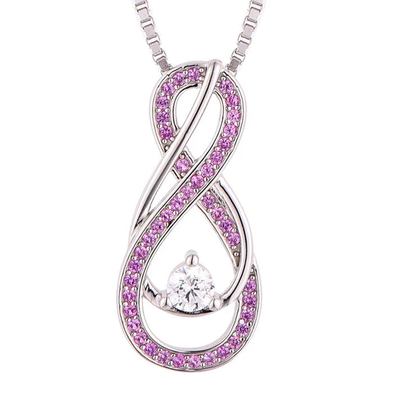 Infinity-shaped pink tourmaline necklace with center CZ stone in sterling silver