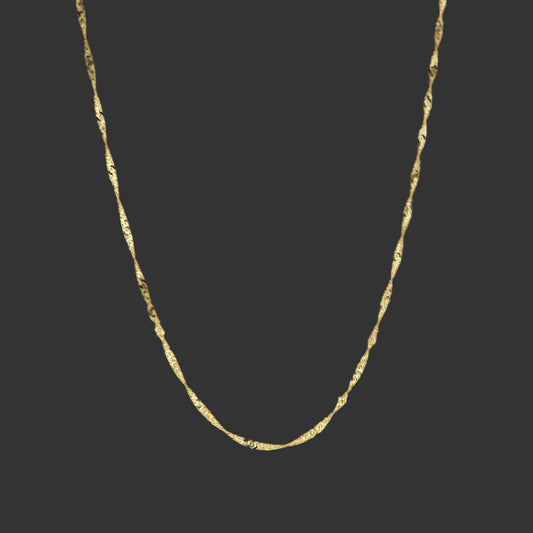 Gold chain necklace on a white background