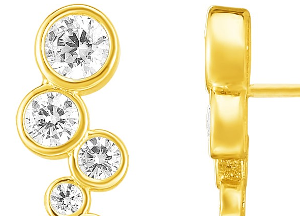 Gold earring with clear gemstones on a white background