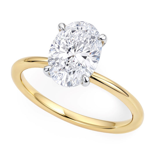 Gold ring with a large diamond on a white background