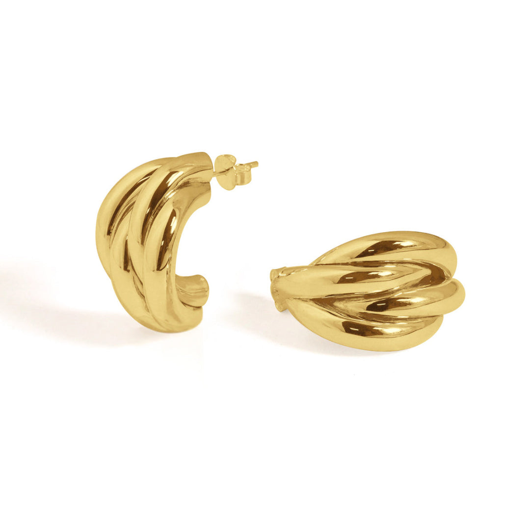 High-polish gold-tone twisted hoop earrings featuring a retro-inspired, elegant aesthetic.