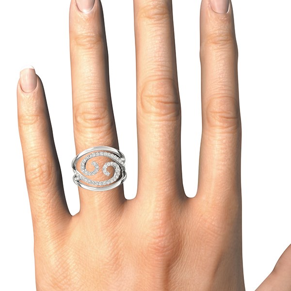 Silver ring with diamonds on a hand against a white background