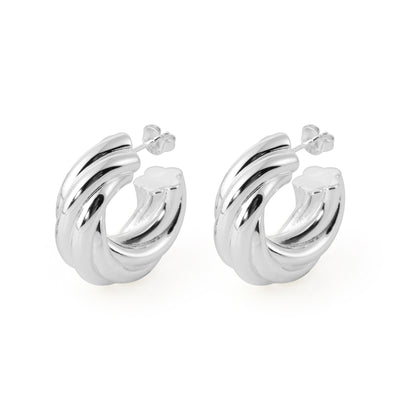 Silver hoop earrings on a white background