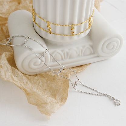 Elegant Gold Dollar Sign Bracelet – Double Chain with CZ Sparkle