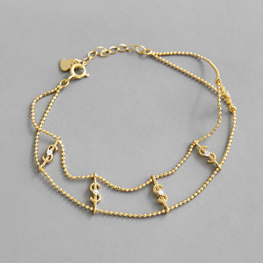 Elegant Gold Dollar Sign Bracelet – Double Chain with CZ Sparkle