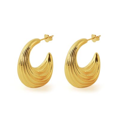 Gold hoop earrings on a white background