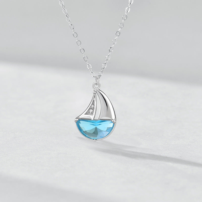 Sterling Silver Sailboat Necklace with Blue CZ Crystal – Nautical Jewelry