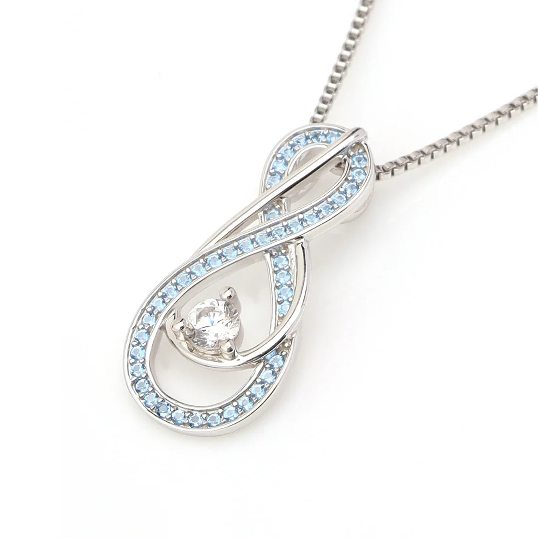"Infinity pendant necklace with aquamarine blue birthstones and central crystal on silver chain"