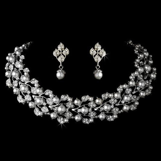 Bridal pearl and rhinestone choker necklace set with matching earrings displayed on black background