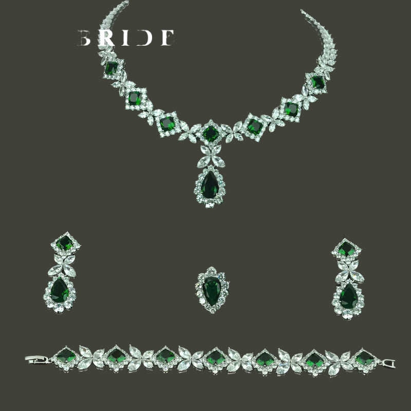 Luxurious 4-piece cubic zirconia wedding set with shimmering green and clear stones
