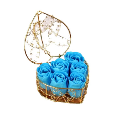 Elegant preserved blue roses in a delicate gold wire heart-shaped case – ideal for anniversaries and special occasions.