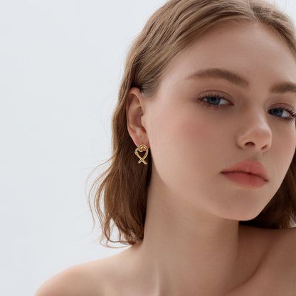 Stylish gold-plated minimalist heart earrings with an elegant, intertwined structure.
