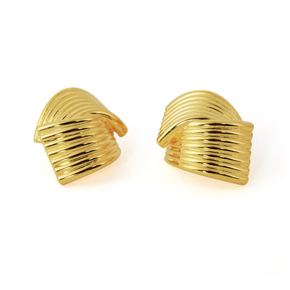 Elegant gold-tone ribbed knot earrings – vintage-inspired sculpted jewelry.