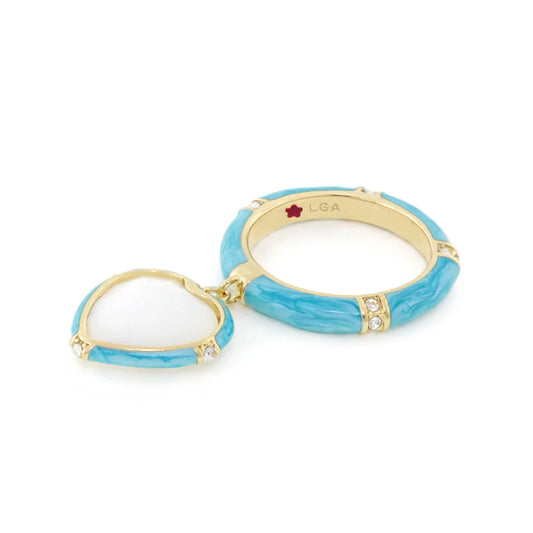 Gold and turquoise double ring with heart charm and sparkling crystal accents.
