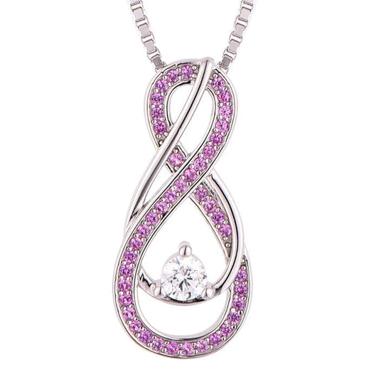 Infinity-shaped pink tourmaline necklace with center CZ stone in sterling silver
