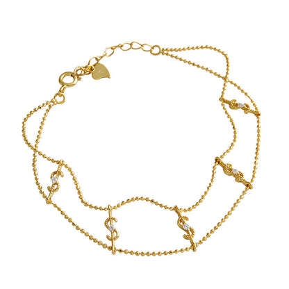 Sterling silver fashion bracelet with gold finish and sparkling dollar charms
