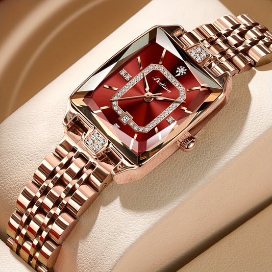 A rose gold-colored women's watch with a red dial and decorative elements on the bracelet.
